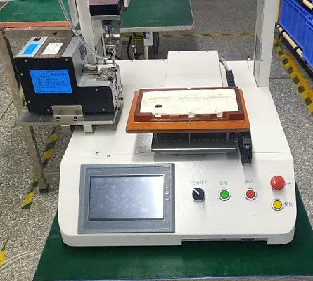 Archived single-workstation screw machine showing its fixture, feeder and control panel