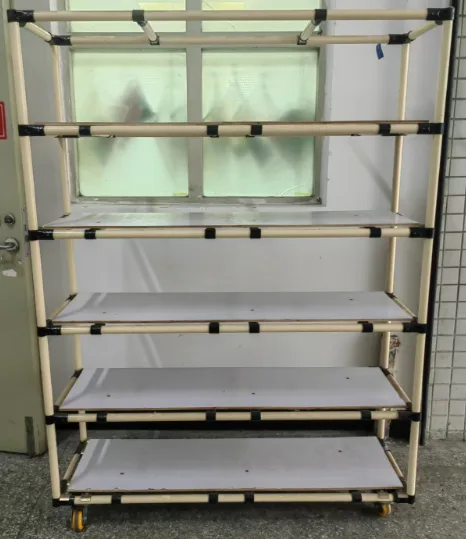 Empty wheeled material-handling rack on the Xinyinhai factory floor