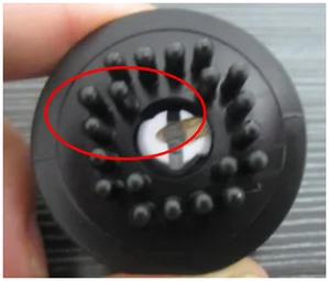 Insect wing contamination. The source identifies an insect wing in the circled area of the black component.
