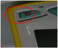 Hair trapped at an assembled part. Follow the red ellipse around the hair crossing the button area.