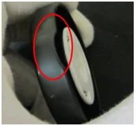 Incomplete molding (short shot). The ellipse marks the area identified as missing molded material.