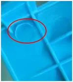 Flash that scratches the hand. The source identifies hand-scratching flash in the circled area.