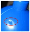 Sink mark. The circled depression is the sink-mark example. The supplied photograph is very small.