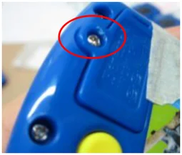 Damaged screw hole. The red ellipse locates damage around the screw hole.