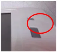 Sunken button. The red ellipse identifies the recessed button.