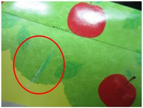 Printing defect on a green page. A second printing-defect example, on a different page.